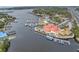 Aerial view captures waterfront restaurants, a marina, and scenic waterfront views, perfect for boaters at 7819 Chasco St, Port Richey, FL 34668