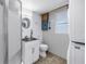 Updated bathroom with shower, vanity, and convenient washer/dryer hookups for added convenience at 7819 Chasco St, Port Richey, FL 34668