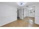 Spacious room featuring tile flooring, neutral walls, and mirrored closet doors at 7819 Chasco St, Port Richey, FL 34668