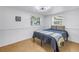Cozy bedroom with neutral tones, tile flooring, and natural light, creating a relaxing atmosphere at 7819 Chasco St, Port Richey, FL 34668