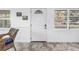 Bright entryway featuring tile floors, natural light, and wainscoting at 7819 Chasco St, Port Richey, FL 34668