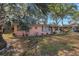 Charming home featuring mature landscaping, and a welcoming facade at 7819 Chasco St, Port Richey, FL 34668