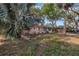 Charming home featuring mature landscaping, and a welcoming facade at 7819 Chasco St, Port Richey, FL 34668