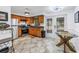 Spacious kitchen with stainless appliances and access to the screened-in patio at 7819 Chasco St, Port Richey, FL 34668