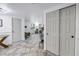 Open concept living room with tile floors and multiple access points at 7819 Chasco St, Port Richey, FL 34668