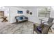 Bright living room featuring tile floors, natural light, and coastal decor at 7819 Chasco St, Port Richey, FL 34668