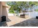 Spacious backyard area with a private hot tub and large shade tree at 810 W Whatley Pl, Tampa, FL 33604