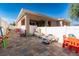 A backyard has outdoor toys, patio, and fence at 810 W Whatley Pl, Tampa, FL 33604