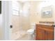 Bright bathroom features a walk-in shower with glass door and vanity with granite countertop at 810 W Whatley Pl, Tampa, FL 33604