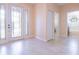 The foyer of a home with marble-like tile and white trim at 810 W Whatley Pl, Tampa, FL 33604