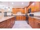 Spacious kitchen with granite countertops, stainless steel appliances, and ample cabinet space at 810 W Whatley Pl, Tampa, FL 33604