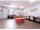 Bright and airy playroom featuring multiple learning stations and tables, perfect for education and fun at 810 W Whatley Pl, Tampa, FL 33604