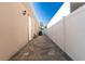 Paver walkway between the house and a vinyl privacy fence, connecting the front and back yards at 810 W Whatley Pl, Tampa, FL 33604