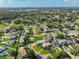 Neighborhood aerial view of the property showcasing lush landscaping and proximity to local amenities at 8420 Orient Ne Way, St Petersburg, FL 33702
