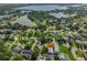 Real estate showcasing a home surrounded by mature trees, lush landscaping, and scenic water views at 8420 Orient Ne Way, St Petersburg, FL 33702