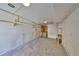 Unfinished basement provides potential for customization with exposed pegboard walls and concrete flooring at 8420 Orient Ne Way, St Petersburg, FL 33702