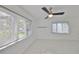Sunlit room with large windows and tiled flooring, offering a spacious and airy feel at 8420 Orient Ne Way, St Petersburg, FL 33702