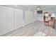Bright bedroom with laminate flooring, ceiling fan, and generous closet space, perfect for a guest room at 8420 Orient Ne Way, St Petersburg, FL 33702