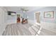 Bright bedroom featuring a ceiling fan, closet space, and an ensuite bathroom with modern finishes at 8420 Orient Ne Way, St Petersburg, FL 33702
