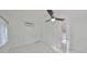 Bright bedroom featuring a modern ceiling fan and a clean, all-white aesthetic at 8420 Orient Ne Way, St Petersburg, FL 33702