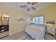 Bedroom featuring wood-look floors, ceiling fan, and neutral-toned walls at 8420 Orient Ne Way, St Petersburg, FL 33702