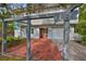 Inviting home with a covered entrance, brick patio, attached garage, and prominent house number at 8420 Orient Ne Way, St Petersburg, FL 33702