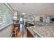 Modern kitchen with stainless steel appliances, granite countertops, tile backsplash, and an open layout at 8420 Orient Ne Way, St Petersburg, FL 33702