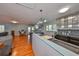 Open-concept kitchen with stainless appliances, an island counter, and seamless flow to the living area at 8420 Orient Ne Way, St Petersburg, FL 33702