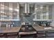 Modern kitchen featuring stainless steel appliances, cabinetry, backsplash, and granite countertops at 8420 Orient Ne Way, St Petersburg, FL 33702