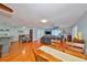 Inviting living room featuring hardwood floors, ceiling fan, and an open layout with lots of natural light at 8420 Orient Ne Way, St Petersburg, FL 33702