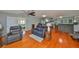 Spacious living room offering a comfortable seating arrangement, lots of natural light, and access to other rooms at 8420 Orient Ne Way, St Petersburg, FL 33702