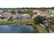 A charming single-Gathering home features a fenced yard and a serene lake view at 10108 36Th E Ct, Parrish, FL 34219
