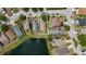 Aerial view of the house in a community near a pond at 10108 36Th E Ct, Parrish, FL 34219