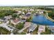 Aerial view of houses in a subdivision with a lake at 10108 36Th E Ct, Parrish, FL 34219