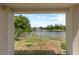 Backyard view from the covered patio overlooking the pond and lush landscape at 10108 36Th E Ct, Parrish, FL 34219