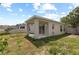 Home exterior showing backyard with patio and partial fence line at 10108 36Th E Ct, Parrish, FL 34219