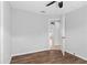 Bedroom featuring wood-look floors, ceiling fan, and neutral color palette at 10108 36Th E Ct, Parrish, FL 34219