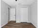 Bedroom with wood-look floors, neutral walls, and closet at 10108 36Th E Ct, Parrish, FL 34219