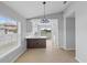 Dining area with white cabinetry, quartz countertops, and a large window at 10108 36Th E Ct, Parrish, FL 34219