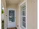 The home features a white door with a matching trim and a window next to it at 10108 36Th E Ct, Parrish, FL 34219