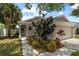 Charming single-story home with a well-manicured front garden and attached garage at 10108 36Th E Ct, Parrish, FL 34219