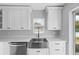 Modern kitchen featuring a stainless steel sink, white cabinetry, and stainless steel appliances at 10108 36Th E Ct, Parrish, FL 34219