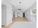 Open-concept living area featuring tile flooring, neutral walls and updated lighting at 10108 36Th E Ct, Parrish, FL 34219