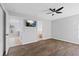 Bright main bedroom with hardwood floors, ceiling fan, and ensuite bathroom access at 10108 36Th E Ct, Parrish, FL 34219