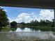 Scenic pond view from the property, offering a tranquil atmosphere and natural beauty at 10108 36Th E Ct, Parrish, FL 34219