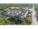 Aerial view of community, highlighting surrounding greenery and lake at 1110 Rose Blossom Ct, Tampa, FL 33613