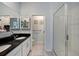 Bathroom with dual sink vanity, walk-in glass shower, and ample counter space at 1110 Rose Blossom Ct, Tampa, FL 33613