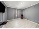 Bedroom features tile floors, gray walls, and ample natural light at 1110 Rose Blossom Ct, Tampa, FL 33613