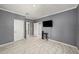 This bedroom features wood look tile, gray paint and white trim at 1110 Rose Blossom Ct, Tampa, FL 33613