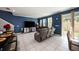 Bright open-concept living space featuring tile floors, an island bar and contemporary furnishings at 1110 Rose Blossom Ct, Tampa, FL 33613
